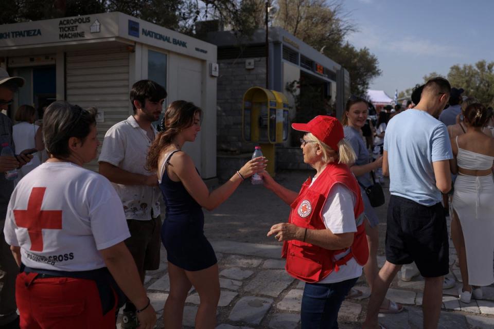 Red Cross outside the Acropolis in Greece amid 43C temperatures (REUTERS)