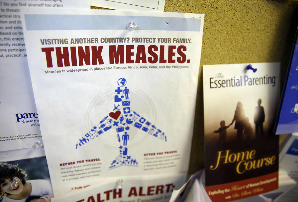 FILE - In this Feb. 6, 2015, file photo, a flyer educating parents about measles is displayed on a bulletin board at a pediatrics clinic in Greenbrae, Calif. State health officials say the number of measles cases is up in California in 2019 and much of the increase is linked to overseas travel. Dr. Karen Smith, director of the California Department of Public Health, says the state recorded 38 measles cases as of Thursday, April 25, 2019, versus 11 around the same time last year. She says the state typically sees fewer than two dozen cases a year. (AP Photo/Eric Risberg, File)