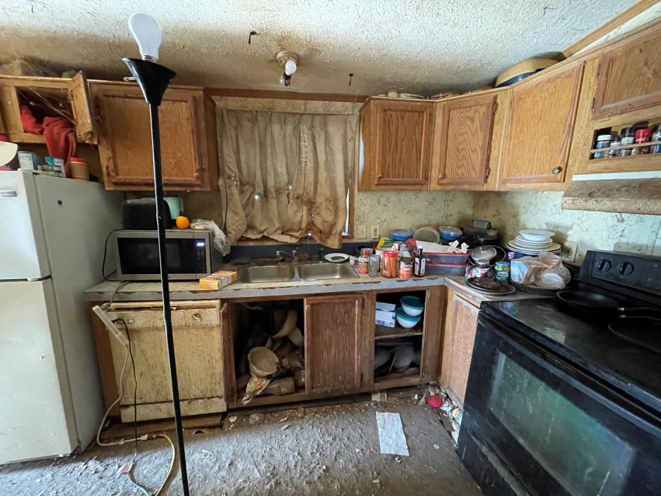 Before renovations, Sylvia Wolfe's kitchen was not functional and full of clutter. She had only two functioning electrical outlets in her home.