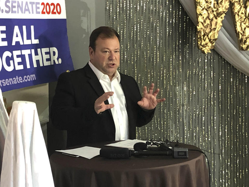 Embattled Democratic U.S. Senate candidate Chris Janicek addresses the media on Monday, Aug. 31, 2020, at his cupcake bakery in Omaha, Neb. Janicek is refusing what's likely to be his last chance to remove his name from the ballot after he admitted to sending sexually offensive text messages to a campaign staffer. (AP Photo/Grant Schulte)