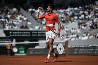 Serbia's Novak Djokovic reacts after winning a point as he plays Slovenia's Aljaz Bedene during their third round match of the French Open tennis tournament at the Roland Garros stadium Friday, May 27, 2022 in Paris. (AP Photo/Thibault Camus)