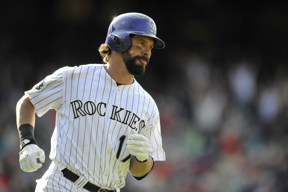 FILE - Colorado Rockies' Todd Helton runs the bases after hitting a solo home run off St. Louis Cardinals relief pitcher Edward Mujica during the ninth inning of a baseball game Sept. 19, 2013, in Denver. Helton, Adrián Beltré and Joe Mauer were elected to baseball's Hall of Fame on Tuesday, Jan. 23, 2024. (AP Photo/Jack Dempsey, File)
