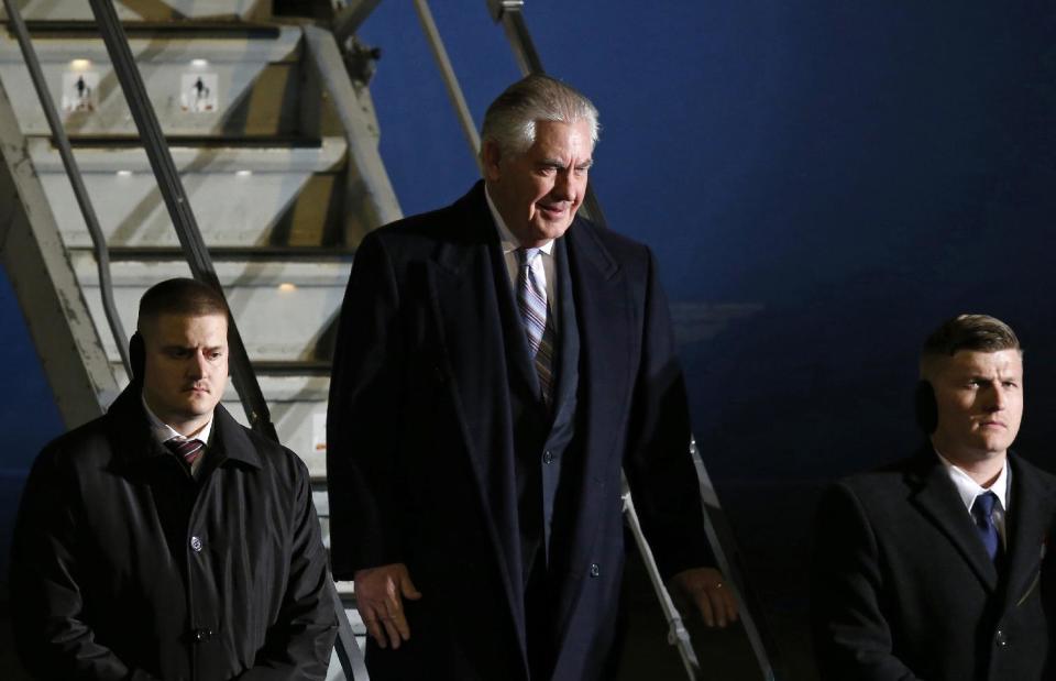 U.S. Secretary of State Rex Tillerson, center, arrives at Haneda international airport in Tokyo, as the first stop of his tour to Asia, Wednesday, March 15, 2017. (Toru Hanai/Pool Photo via AP)