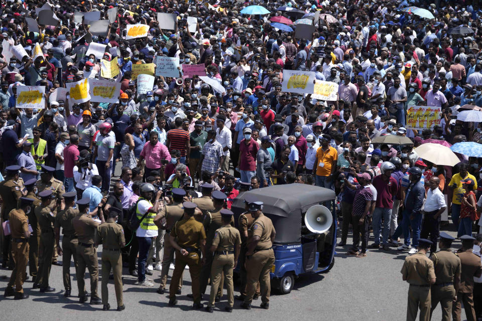 Workers representing government institutions participate in a protest against Sri Lankan president Ranil Wickremesinghe's tax policy in Colombo, Sri Lanka, Wednesday, Feb. 8, 2023. Sri Lanka's president said Tuesday that China has given crucial debt restructuring assurances that mean the bankrupt Indian Ocean nation could get its $2.9 billion bailout package approved soon. (AP Photo/Eranga Jayawardena, file)