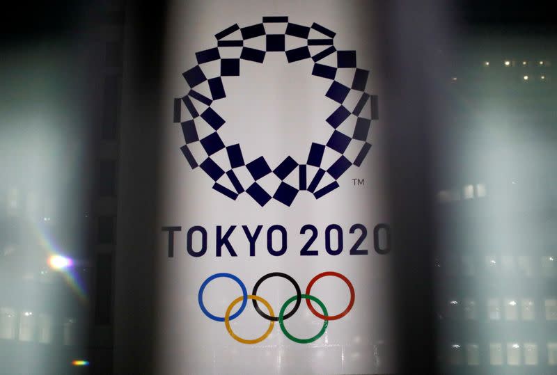 FILE PHOTO: The logo of Tokyo 2020 Olympic Games is seen through signboards, in Tokyo