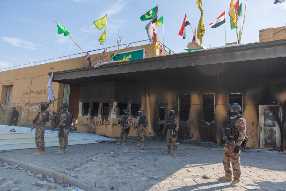 Iraqi army soldiers are deployed in front of the U.S. embassy, in Baghdad, Iraq, Wednesday, Jan. 1, 2020.