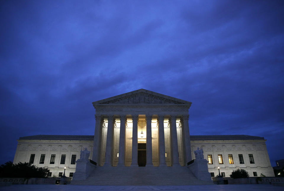 FILE - In this Sept. 27, 2018, file photo, The Supreme Court building is seen at dawn on Capitol Hill in Washington. The Trump administration is asking the Supreme Court to fast-track cases on the president's decision to prevent certain transgender people from serving in the military. The administration asked the court on Nov. 23, to take up three cases on the issue. (AP Photo/Patrick Semansky, File)