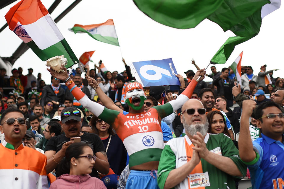 Indian fans celebrate Kohli's 50 (Photo by OLI SCARFF/AFP/Getty Images)