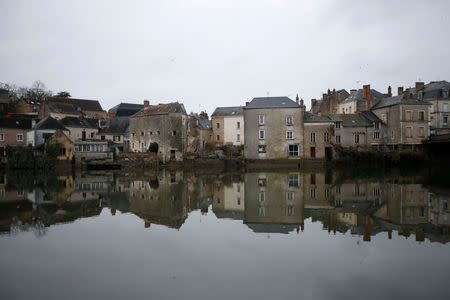 Houses are reflected in the Sarthe River in Sable-sur-Sarthe, western France, January 31, 2017. In Sable-sur Sarthe, a farming town of 13,000 where Francois Fillon, 2017 presidential candidate of the French centre-right, has been the dominant figure since launching himself on a 30-year career in public life which led to a five-year spell as prime minister, Fillon's scandal over his wife’s work is on everyone's minds. Picture taken January 31, 2017. REUTERS/Stephane Mahe