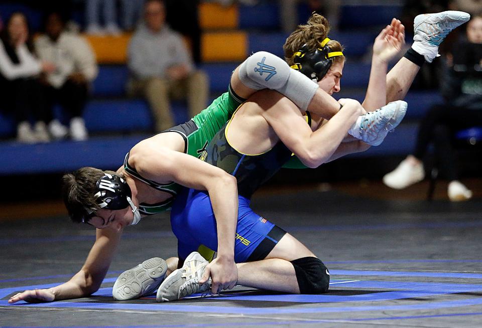 Ontario High School’s Jacob Ohl wrestles Clear Fork High School’s Walker Kirkpatrick during their 120lbs match during the dual match Friday, Feb. 2, 2024 at Ontario High School. TOM E. PUSKAR/MANSFIELD NEWS JOURNAL