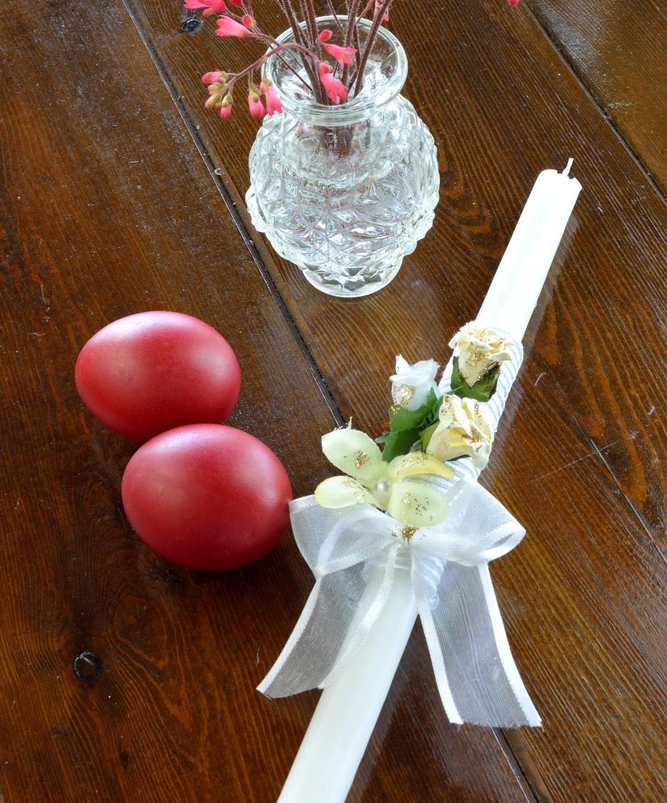 a vase and candle on a table