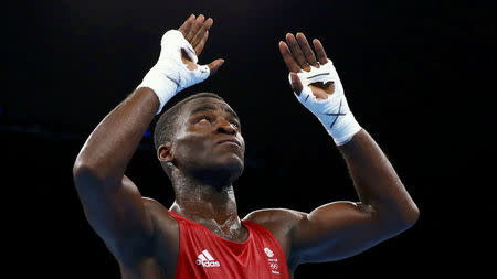 2016 Rio Olympics - Boxing - Quarterfinal - Men's Light Heavy (81kg) Quarterfinals Bout 200 - Riocentro - Pavilion 6 - Rio de Janeiro, Brazil - 14/08/2016. Joshua Buatsi (GBR) of Britain reacts after his bout. REUTERS/Peter Cziborra