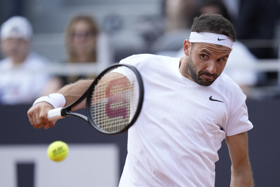 Bulgaria's Grigor Dimitrov returns the ball to Switzerland's Stan Wawrinka during their match at the Italian Open tennis tournament, in Rome, Friday, May 12, 2023. (AP Photo/Andrew Medichini)