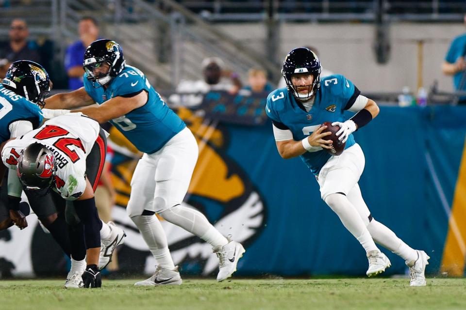 Aug 17, 2024; Jacksonville, Florida, USA; Jacksonville Jaguars quarterback C.J. Beathard (3) scrambles during the third quarter against the Tampa Bay Buccaneers at EverBank Stadium. Mandatory Credit: Douglas DeFelice-USA TODAY Sports