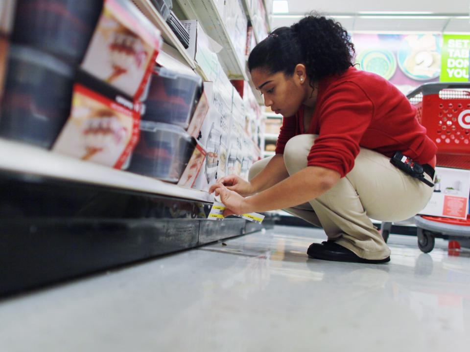 A Target employee restocks shelves on January 5, 2011 in Miami, Florida.