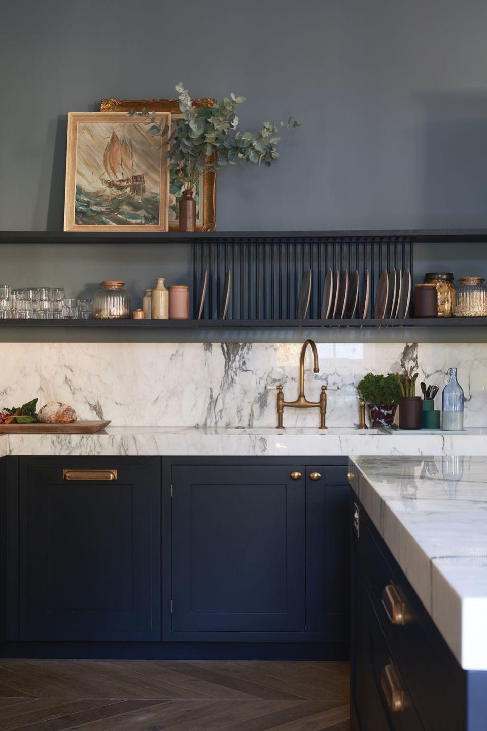 <p>Create a restful colour scheme with dark walls in a kitchen. Whether you choose to match them with your cabinets, or simply opt for a statement wall, don't be afraid to tap into bold and cheerful hues with your paint choices. You really can't beat a deliciously dark kitchen wall.</p><p><strong>BE INSPIRED:</strong> <a href="https://www.housebeautiful.com/uk/decorate/a25747701/farrow-and-ball-colours-2019/" rel="nofollow noopener" target="_blank" data-ylk="slk:These are Farrow & Ball's must-have colours for 2019;elm:context_link;itc:0;sec:content-canvas" class="link ">These are Farrow & Ball's must-have colours for 2019</a></p><p>• Shop the look at <a href="https://www.farrow-ball.com/" rel="nofollow noopener" target="_blank" data-ylk="slk:Farrow & Ball;elm:context_link;itc:0;sec:content-canvas" class="link ">Farrow & Ball</a>. This paint shade is ' De Nimes No.299'</p>