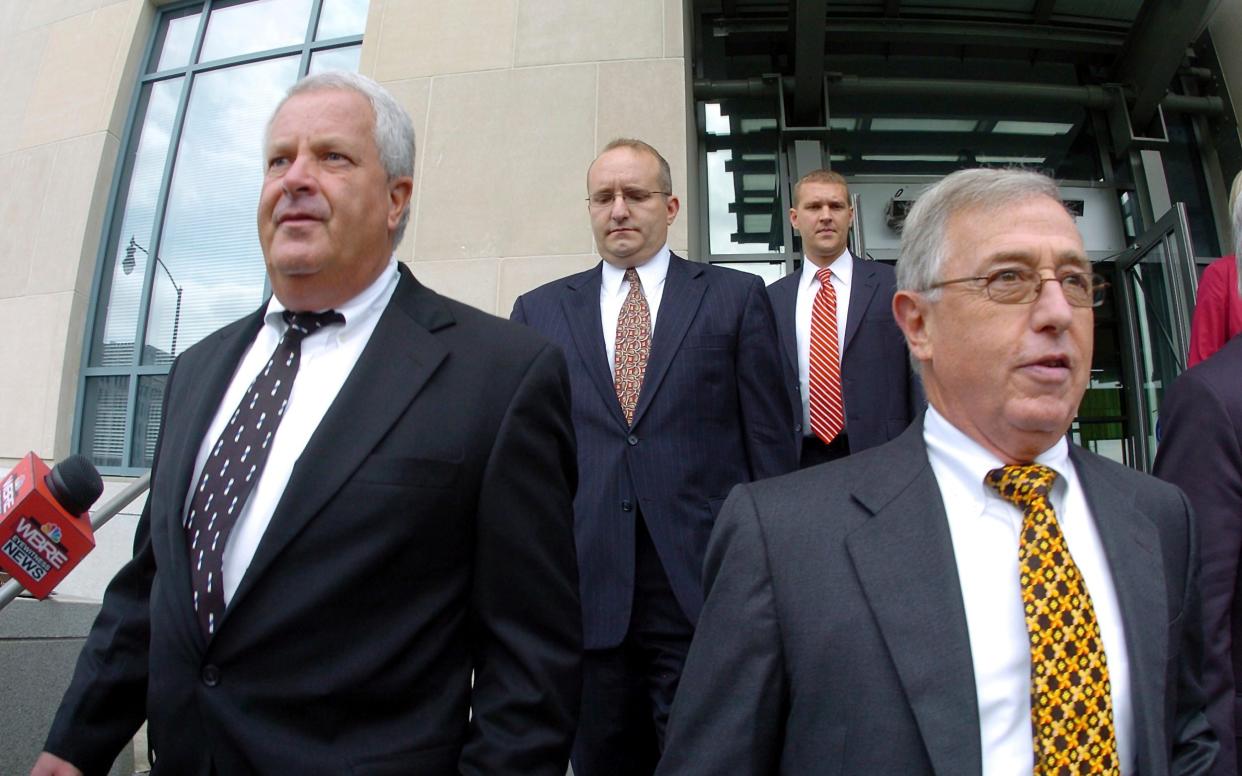 Former judges Michael Conahan, front left, and Mark Ciavarella, front right - Mark Moran /AP