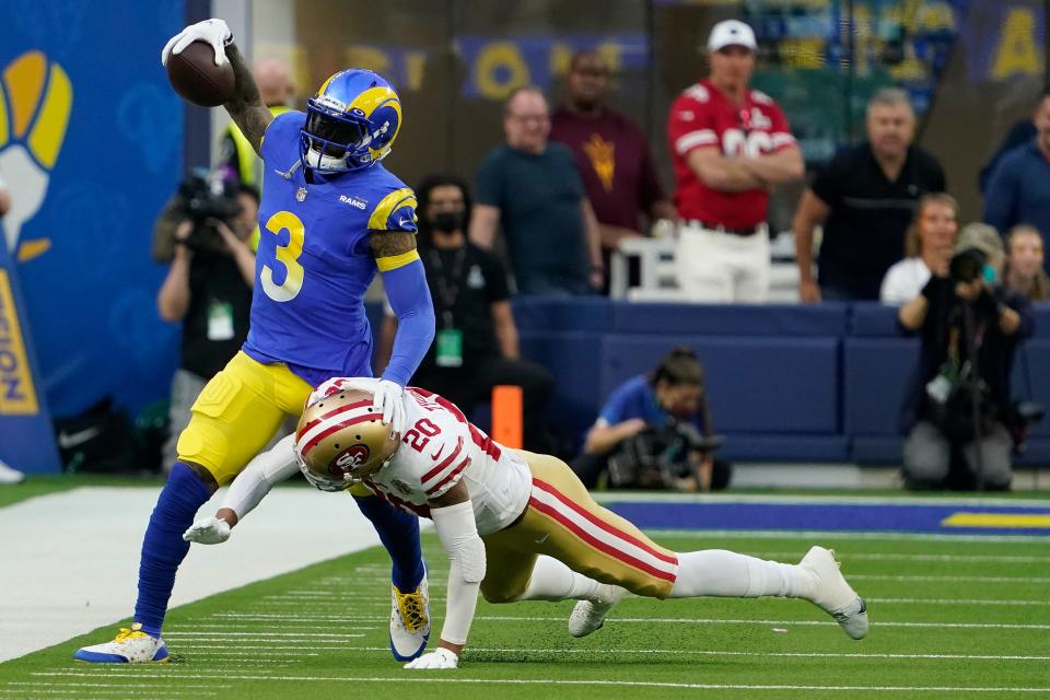 Rams receiver Odell Beckham Jr. tries to elude 49ers defender Ambry Thomas in the first half of the NFC championship game Sunday, Jan. 30, 2022, in Inglewood, Calif.