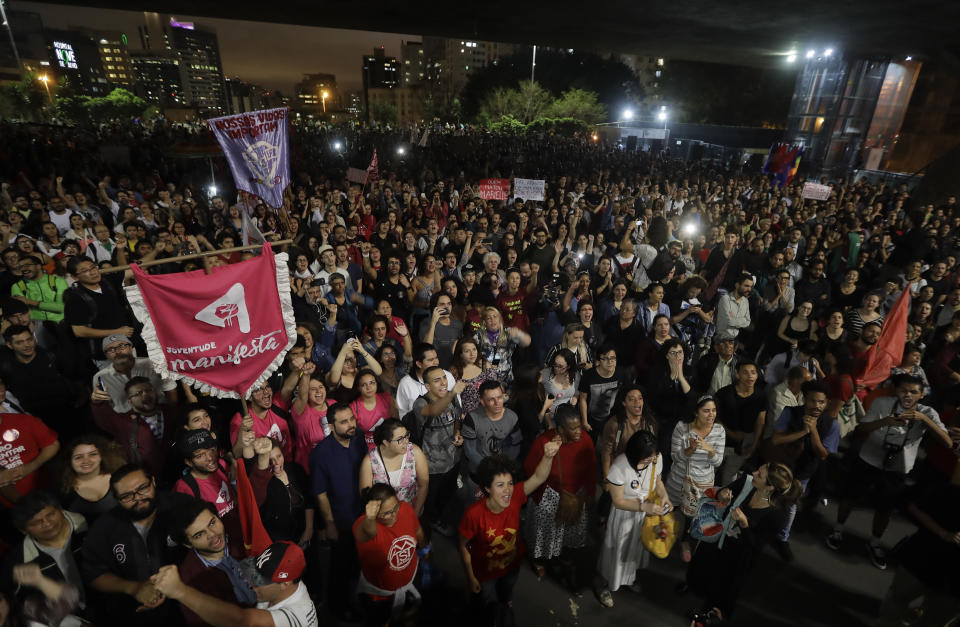 Demonstrators protest Jair Bolsonaro, a far-right presidential candidate, in Sao Paulo, Brazil, Wednesday, Oct. 10, 2018. Bolsonaro will face off with Workers Party candidate Fernando Haddad in an election runoff on Oct. 28. (AP Photo/Andre Penner)