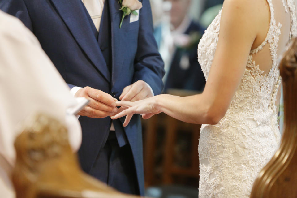 Should brides and grooms feel like they have to invite plus ones? [Photo: Getty]