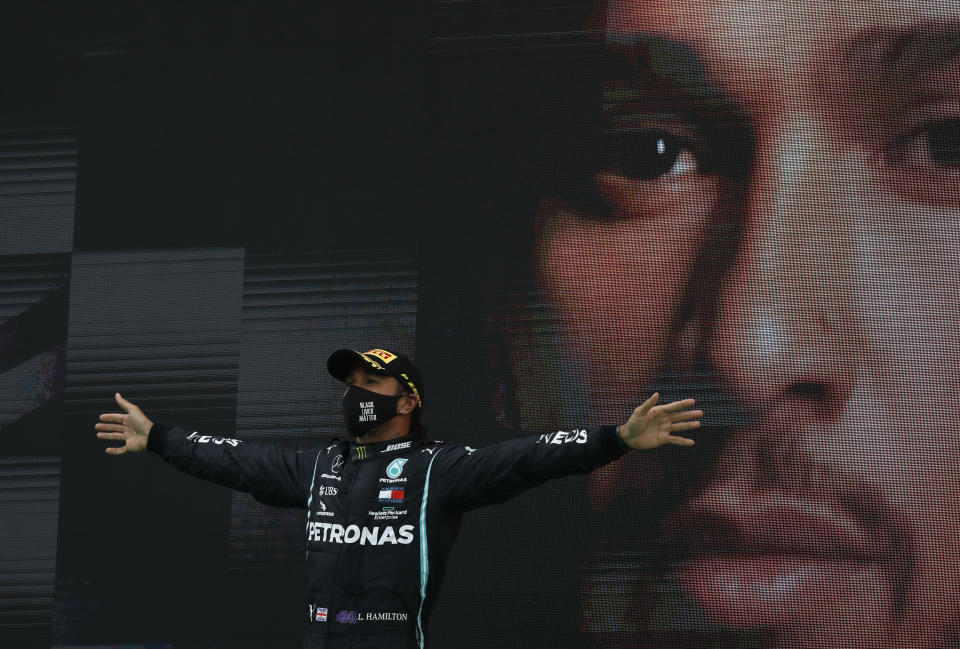 Mercedes driver Lewis Hamilton of Britain celebrates after winning the Formula One Portuguese Grand Prix at the Algarve International Circuit in Portimao, Portugal, Sunday, Oct. 25, 2020. (Rafael Marchante, Pool via AP)