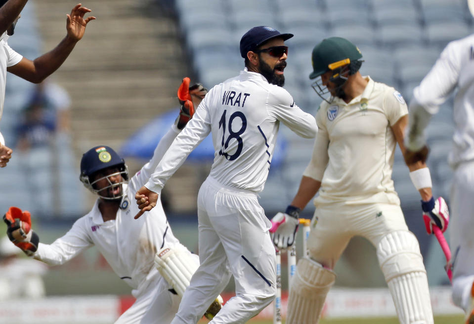 India's Virat Kohli celebrates celebrates the wicket of South Africa's Faf du Plessis during the fourth day of second cricket test match between India and South Africa in Pune, India, Sunday, Oct. 13, 2019. (AP Photo/Rajanish Kakade)