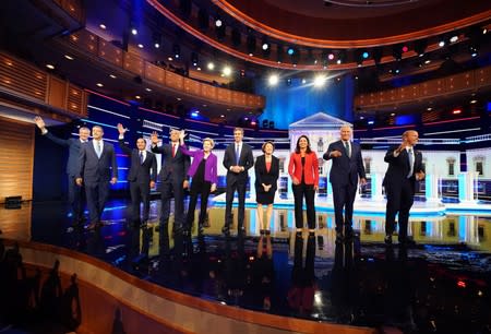 Candidates pose together before the start of the first U.S. 2020 presidential election Democratic candidates debate in Miami, Florida, U.S.,