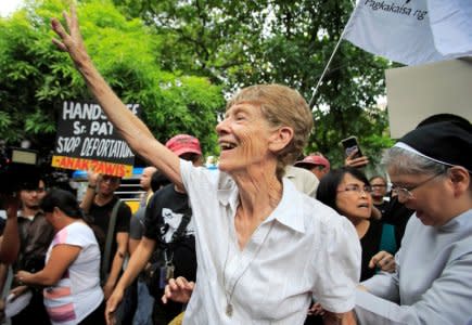 FILE PHOTO: Australian missionary Patricia Fox waves to her supporters before filing a petition calling for the review of her deportation case at the Department of Justice, after the immigration bureau voided her visa following complaints from Philippine President Rodrigo Duterte about her participation in protest rallies, in Padre Faura, metro Manila, Philippines May 25, 2018. REUTERS/Romeo Ranoco/File Photo