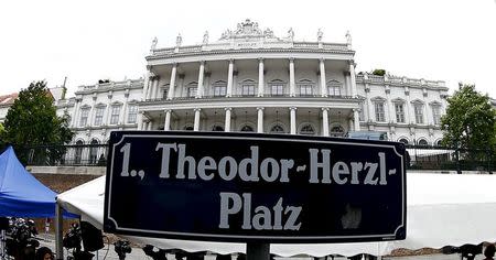 Palais Coburg, the venue for nuclear talks, is seen behind a street sign in Vienna, Austria, July 13, 2015. REUTERS/Leonhard Foeger