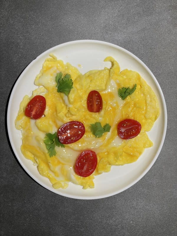 Lucy Liu's Scrambled Eggs with Tomatoes, Basil and Cheese<p>Courtesy of Choya Johnson</p>