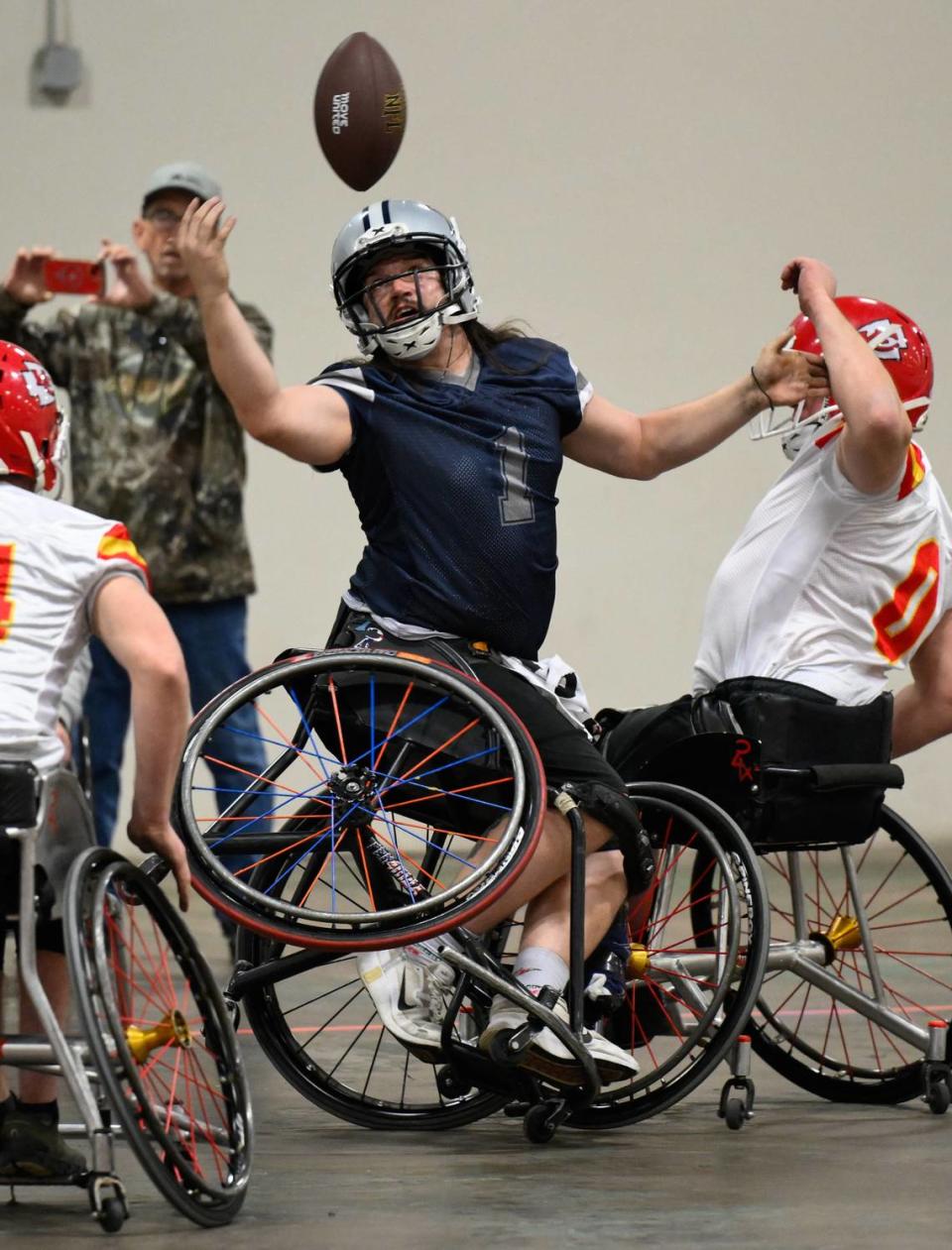 Dallas Cowboys player Zach Blair (1) can’t make a catch of this pass while being guarded by Kansas City Chiefs player Clayton Peters (0) during the USA Wheelchair Football League Championship, a program of Move United, Tuesday, Feb. 6, 2024 in Dallas, Texas.