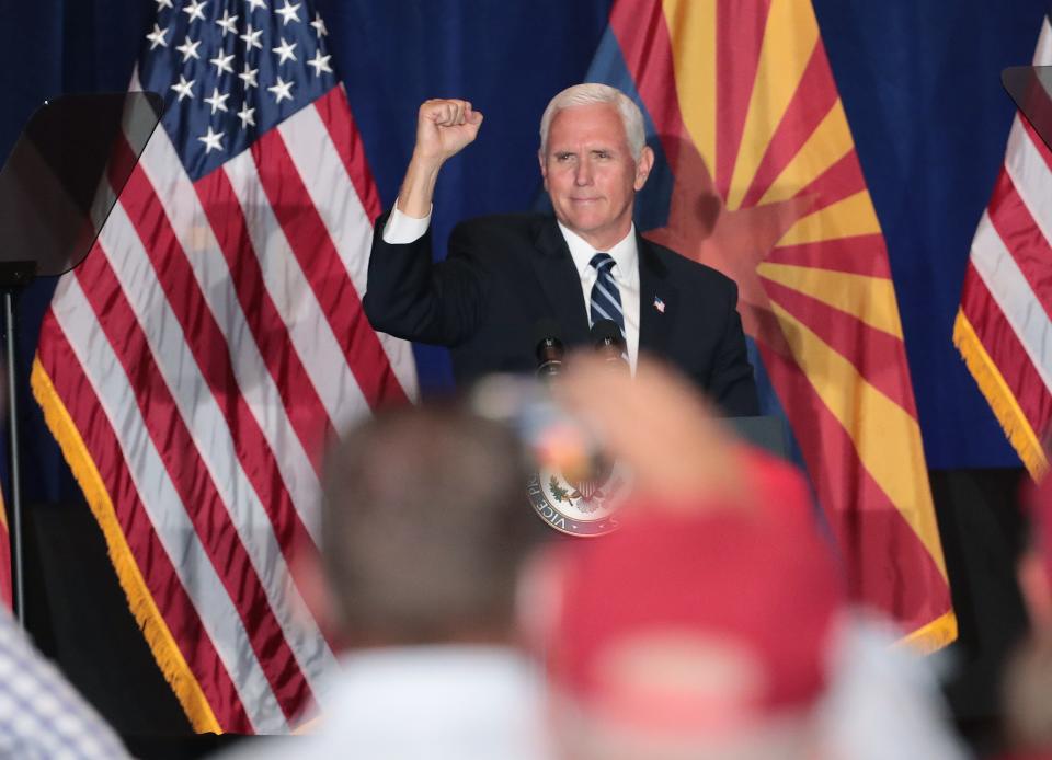 Vice President Mike Pence pumps his fist towards supporters at a "Latter-day Saints for Trump" campaign event in Mesa, Ariz. August 11, 2020.