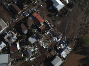 View of buildings destroyed by the floods caused by a deadly extratropical cyclone in Roca Sales, Rio Grande do Sul state, Brazil, Wednesday, Sept. 6, 2023. (AP Photo/Wesley Santos)