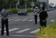 A car with a sign which reads "Special transport for Foreign Affairs Reception" is seen ahead of a convoy of cars that is believed to include U.S. deputy secretary Wendy Sherman as they prepare to enter the Tianjin Binhai No. 1 Hotel where U.S. and Chinese officials are expected to meet in Tianjin municipality in China on Sunday, July 25, 2021. Deputy Secretary of State Wendy Sherman travelled to China this weekend on a visit that comes as tensions between Washington and Beijing soar on multiple fronts, the State Department said Wednesday. (AP Photo/Ng Han Guan)