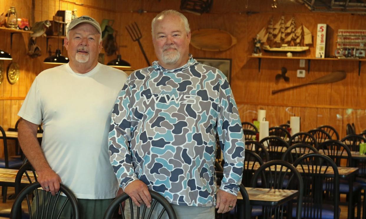 Brothers Danny and Darriel Love pose together inside Love’s Fish Box on Shelby Road in Kings Mountain.