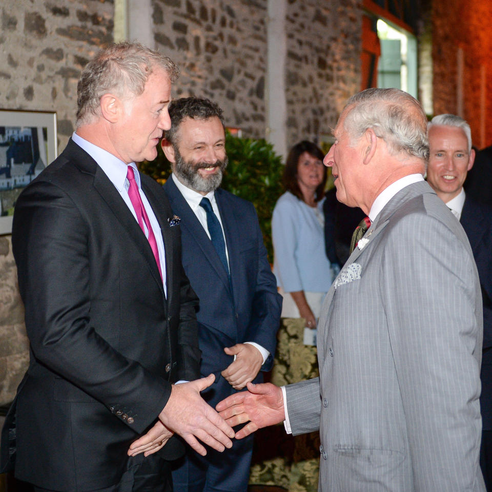 Owen Teale (left), and Michael Sheen greet the Prince of Wales at his Welsh home near Llandovery, Wales, where he is hosting a music & drama evening also featuring performances by students of the Royal Welsh College of Music and Drama.