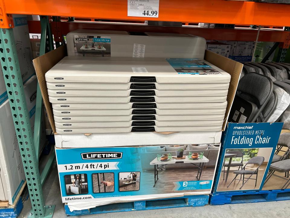 stack of folding tables in costco