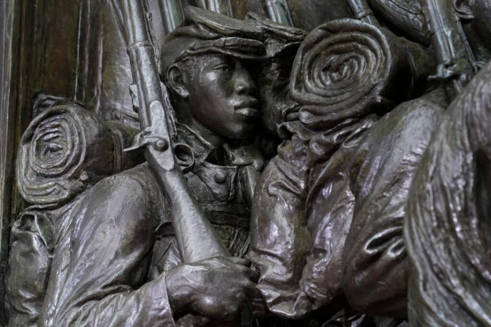 A detail of the Robert Gould Shaw and the 54th Massachusetts Regiment Memorial features a soldier holding a rifle before re-dedication ceremonies on the Boston Common, Wednesday, June 1, 2022, in Boston. The celebration comes on the 125th anniversary of the original unveiling of the bronze relief, which is considered the nation’s first honoring Black soldiers. (AP Photo/Steven Senne)