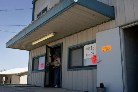 FILE PHOTO: Chester Kolodziej leaves a polling station after casting his vote in the Texas Primary in La Vernia, Texas, U.S. on March 4, 2008. REUTERS/Jessica Rinaldi/File Photo