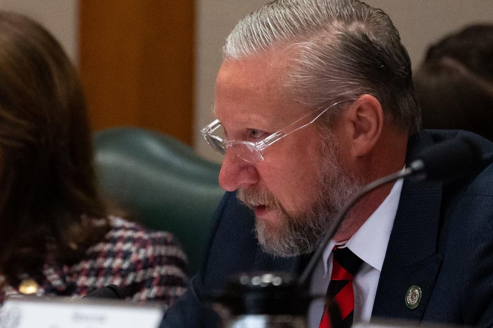 Senator Drew Springer listens to testimony on several bills during a Senate Committee on Education hearing at the Texas State Capitol, March 8, 2023. 