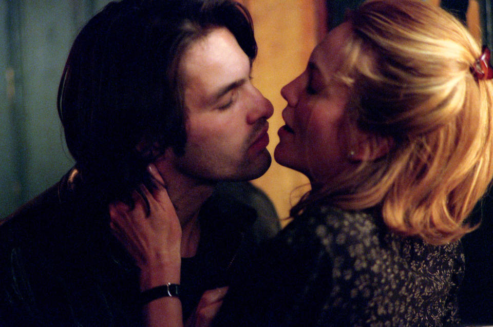 Olivier Martinez and Diane Lane in a close-up, portraying a romantic scene with a man gently holding the woman's neck