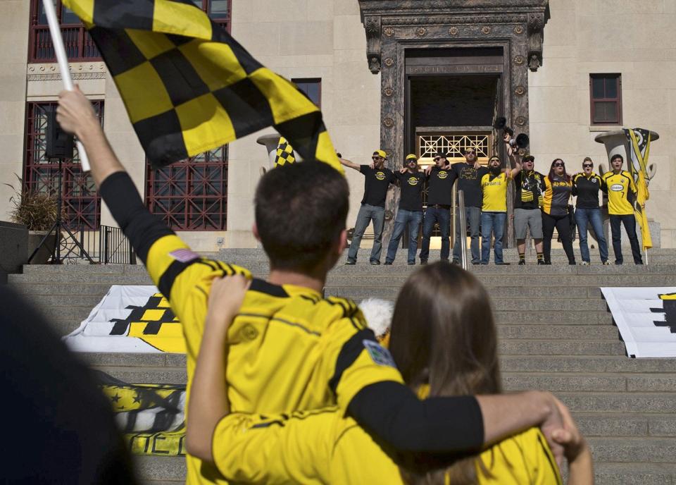 Lead by leaders of the supporter groups, fans sing their support for the team at the Save The Crew rally at City Hall in Columbus, Ohio on Sunday, Oct. 22, 2017. [Emma Howells / Dispatch]