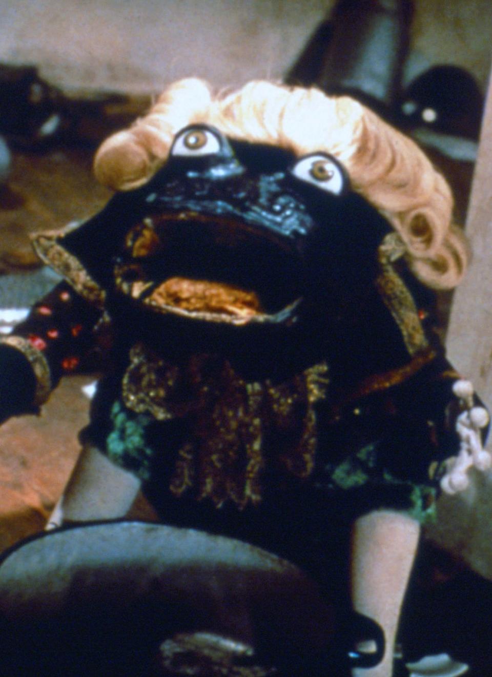 frog puppet with wig from "Alice" movie