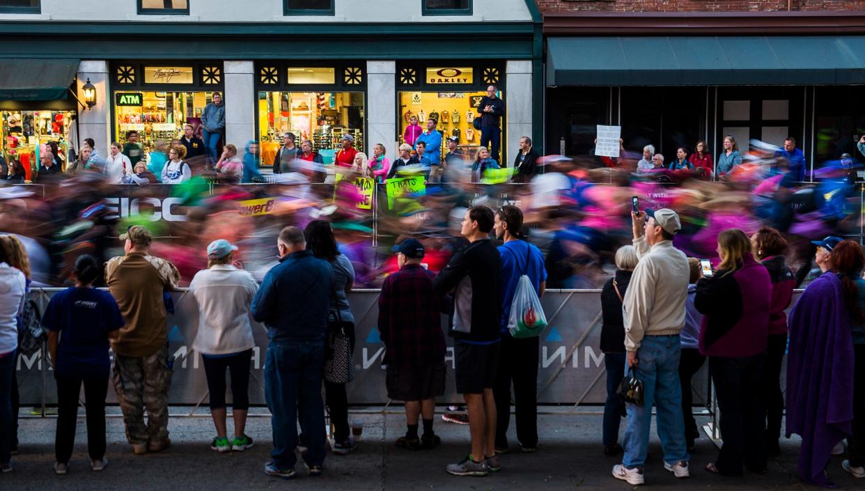 Friends and family watch as runners pass by on Bay Street Saturday morning November 5, 2016 during the Rock 'n' Roll Marathon.