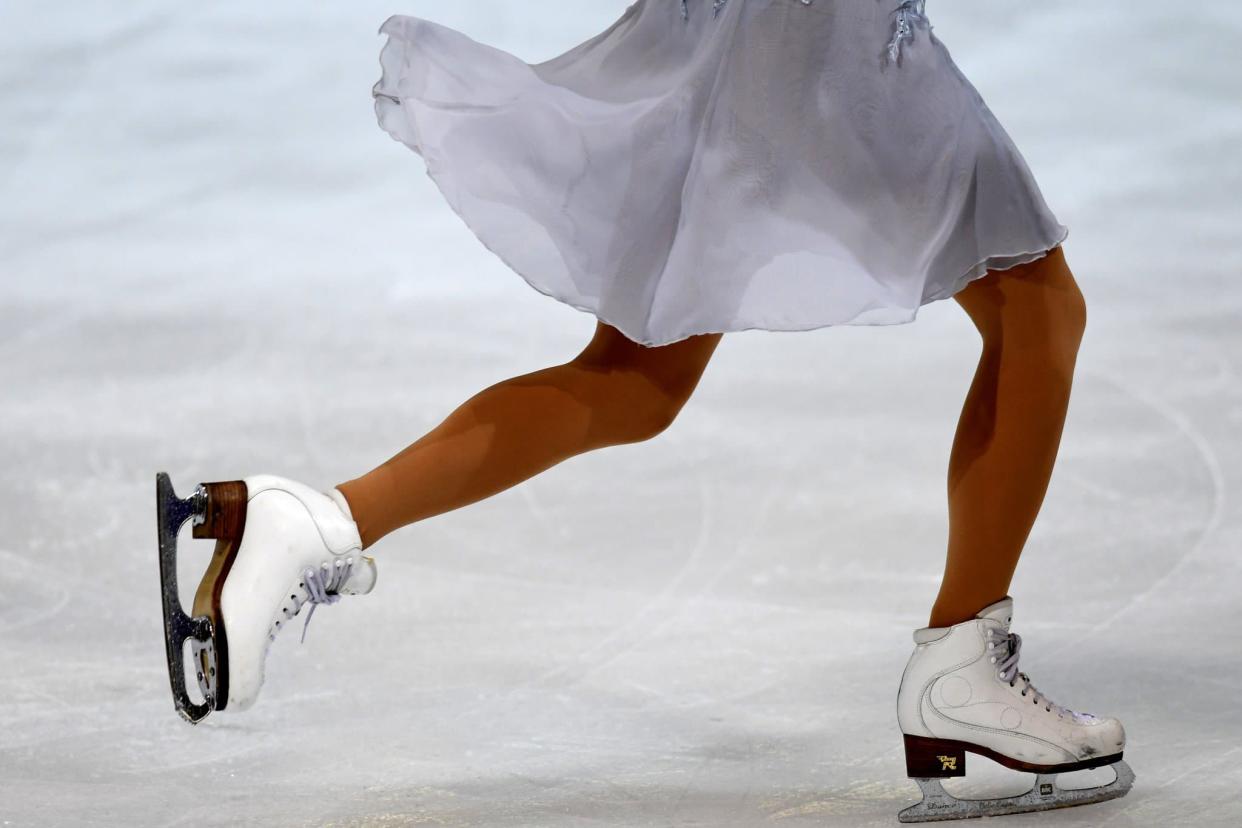 Une femme pratiquant du patinage artistique (PHOTO D'ILLUSTRATION). - JEAN-PIERRE CLATOT / AFP