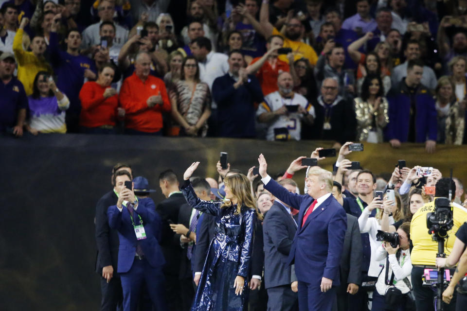 President Donald Trump and first lady Melania Trump attend the NCAA College Football Playoff national championship game Monday, Jan. 13, 2020, in New Orleans. (AP Photo/Gerald Herbert)