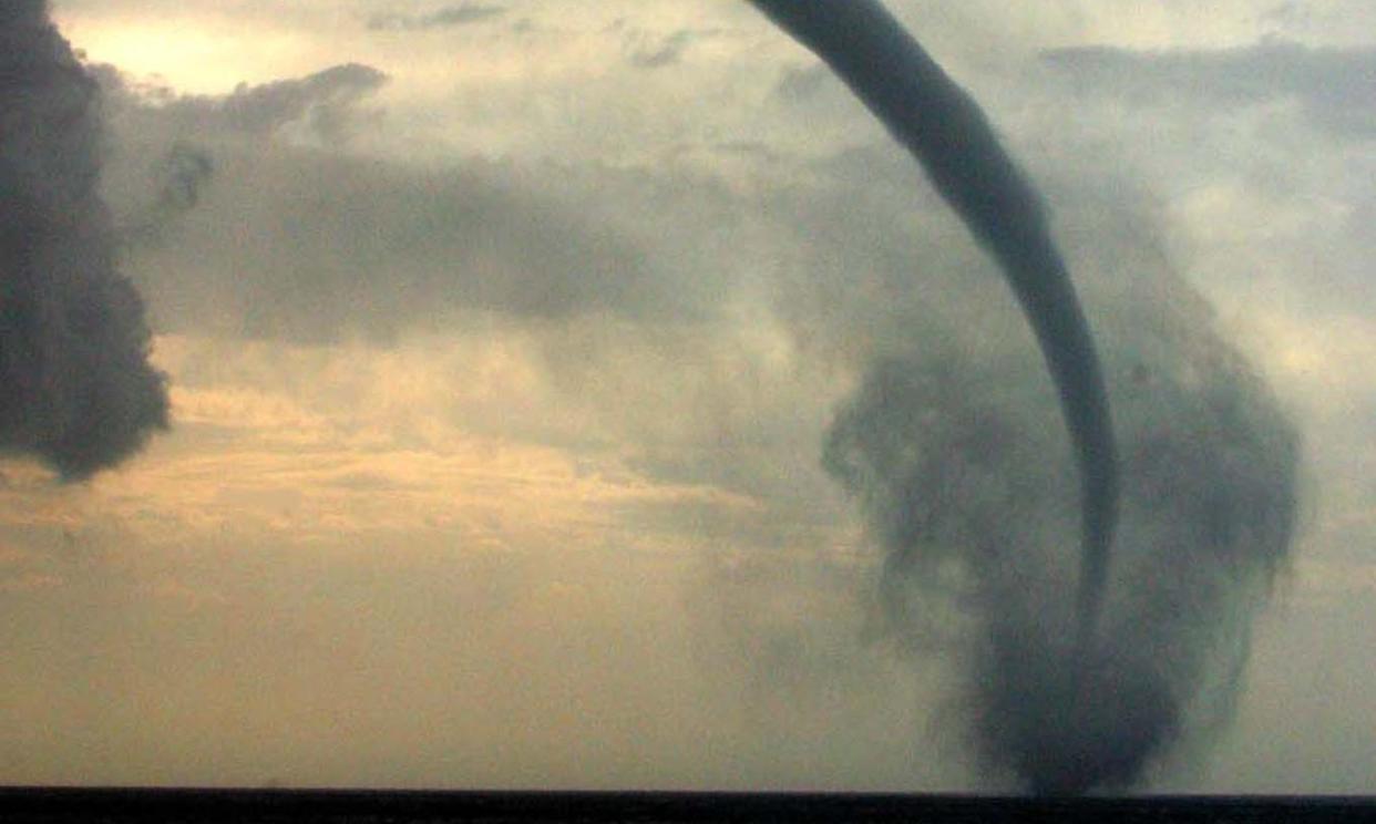 <span>A tornadic waterspout off the coast of Cyprus.</span><span>Photograph: Andreas Manolis/Reuters</span>