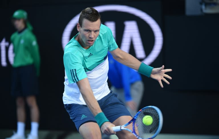 Tomas Berdych plays a backhand return against Roberto Bautista Agut in Melbourne on January 24, 2016