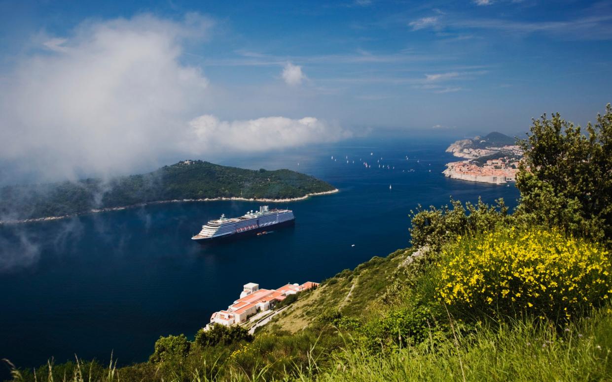 Cruise ship in Adriatic Sea with Dubrovnik in background - Adam Jones/Stone RF