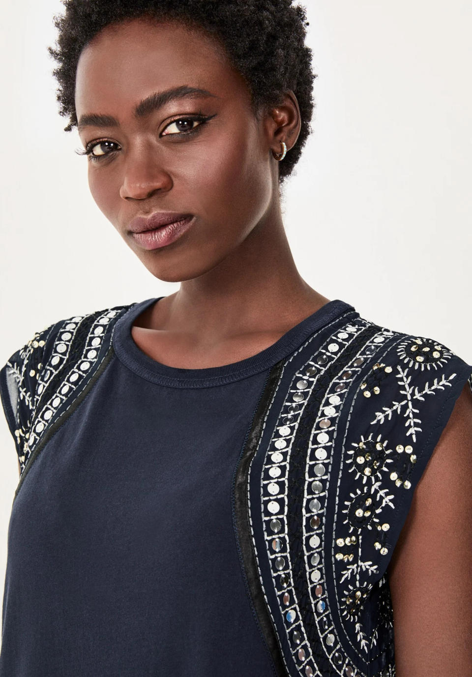 The sequin and bead detailing on the sleeves adds wow factor. (Hush)